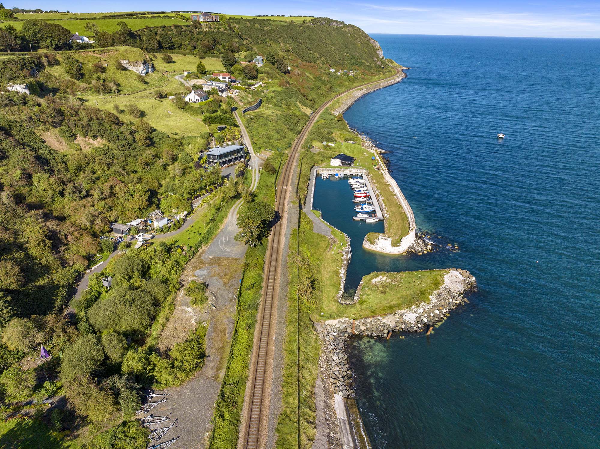 Drone shot of Whiteharbour with traintracks going to Whitehead